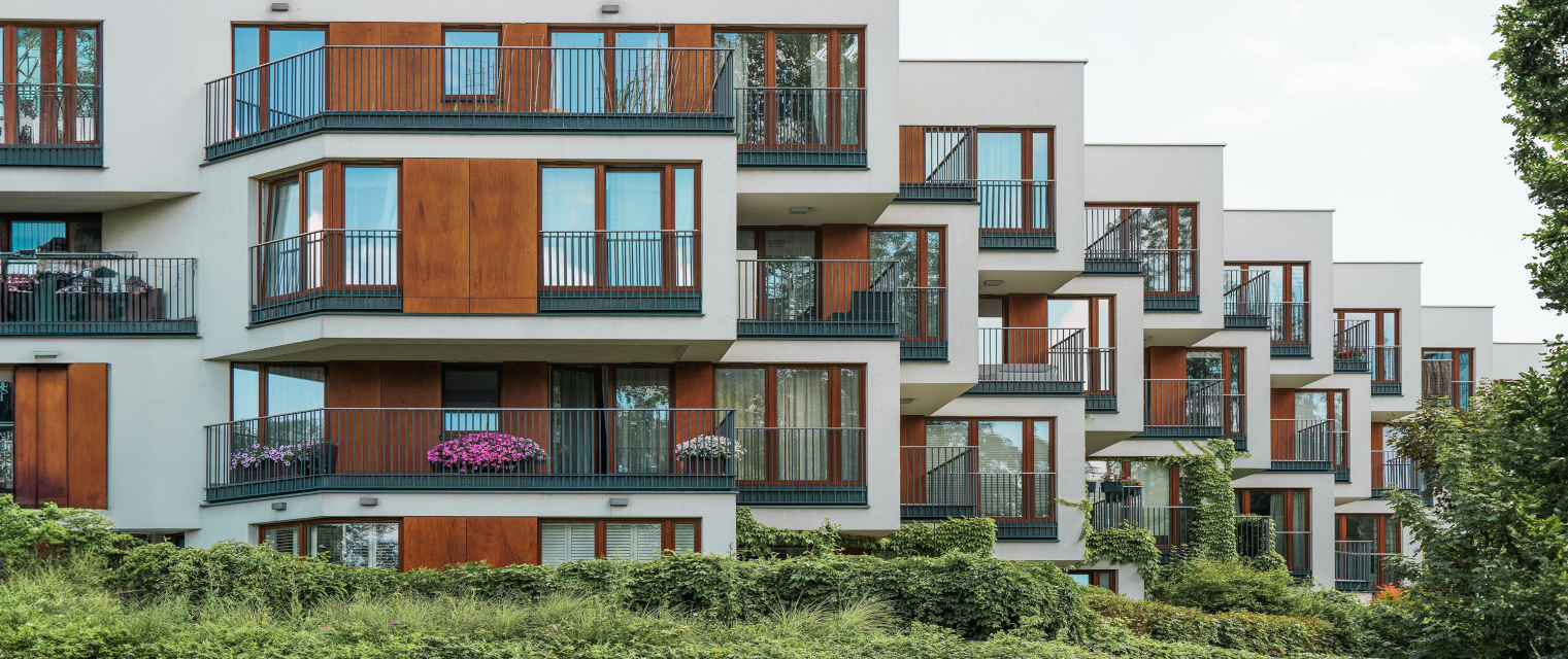 A modern residential tower at golden hour